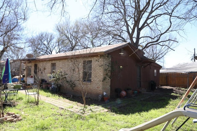 110 Hergotz Ln, Austin, TX 78742 - view of side of home featuring brick siding