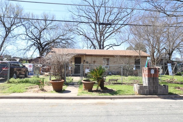 110 Hergotz Ln, Austin, TX 78742 - view of front of home featuring brick siding and a fenced front yard