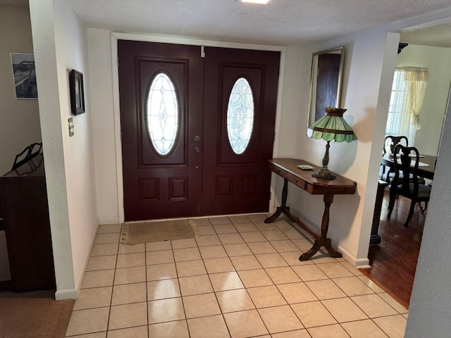 11202 Balcones Woods Cv, Austin, TX 78759 - foyer featuring healthy amount of natural light and a textured ceiling