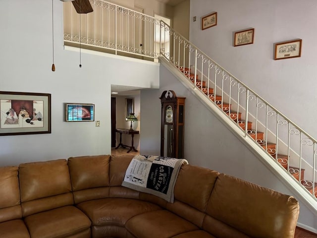 11202 Balcones Woods Cv, Austin, TX 78759 - living area featuring a towering ceiling, stairway, and ceiling fan