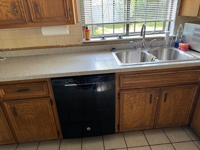 11202 Balcones Woods Cv, Austin, TX 78759 - kitchen with dishwasher, brown cabinets, light countertops, backsplash, and light tile patterned floors