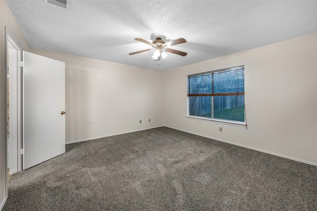 8802 Peppergrass Cv, Austin, TX 78745 - carpeted empty room with ceiling fan and a textured ceiling