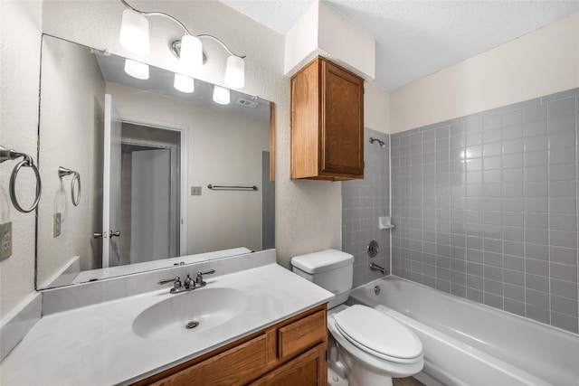 8802 Peppergrass Cv, Austin, TX 78745 - bathroom with vanity, a textured wall, bathing tub / shower combination, and a textured ceiling
