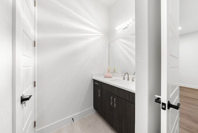 bathroom featuring vanity and baseboards