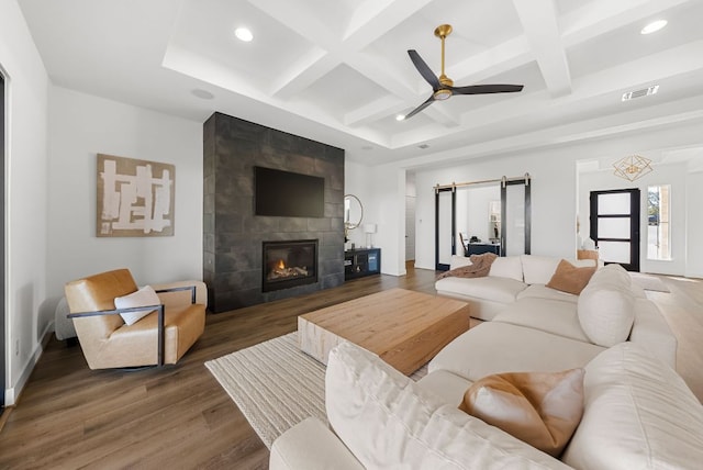 living room with recessed lighting, wood finished floors, beamed ceiling, visible vents, and coffered ceiling