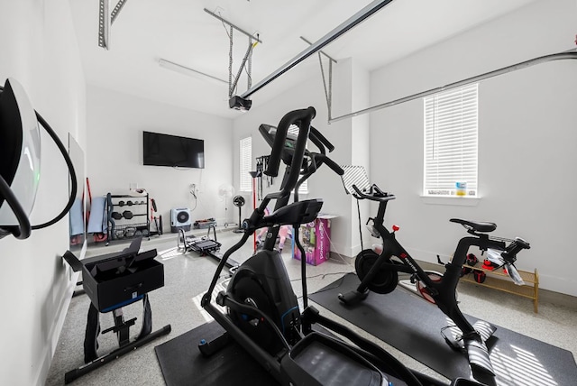exercise room with baseboards