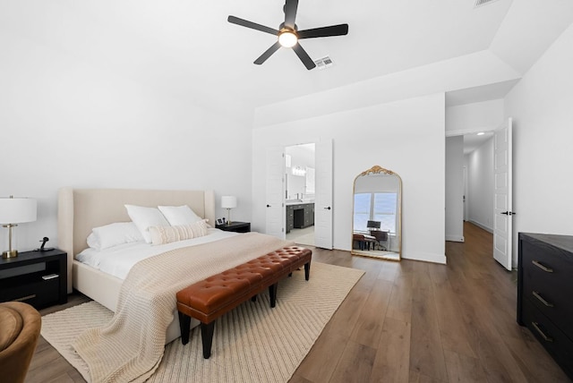 bedroom with ceiling fan, dark wood-style flooring, connected bathroom, and visible vents