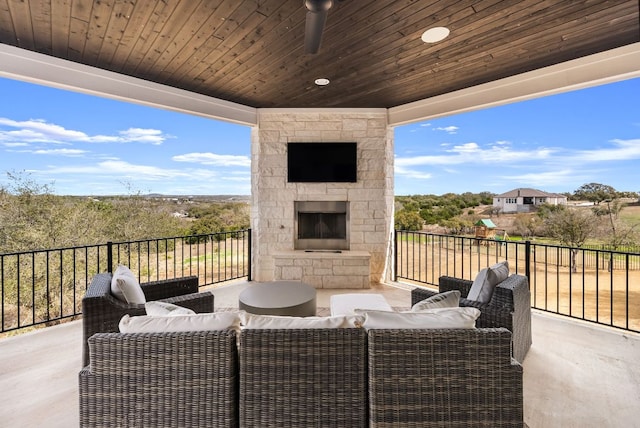 view of patio / terrace featuring an outdoor living space with a fireplace