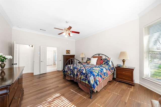10005 Cormorant Cv, Austin, TX 78730 - bedroom with light wood-type flooring, baseboards, crown molding, and ceiling fan