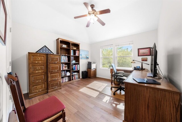 10005 Cormorant Cv, Austin, TX 78730 - home office with vaulted ceiling, a ceiling fan, light wood-style floors, and baseboards