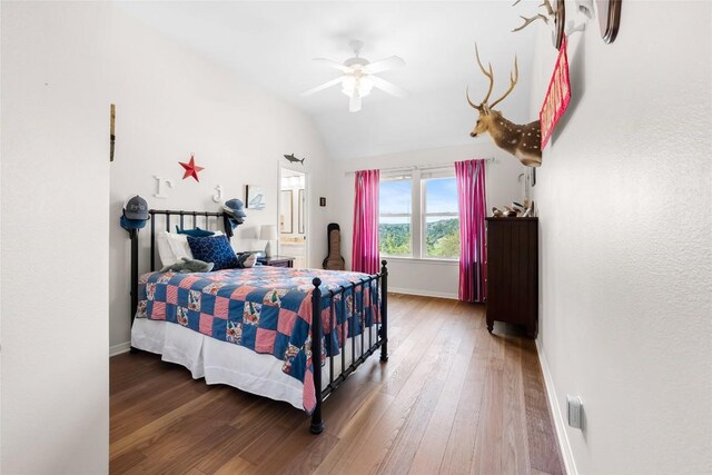 10005 Cormorant Cv, Austin, TX 78730 - bedroom featuring wood finished floors, baseboards, vaulted ceiling, and a ceiling fan