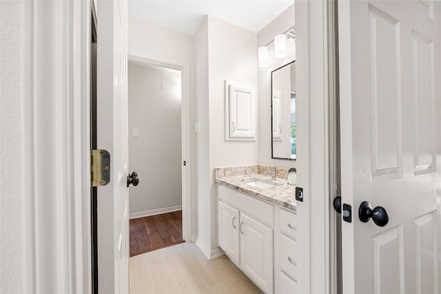 10005 Cormorant Cv, Austin, TX 78730 - bathroom featuring vanity and baseboards
