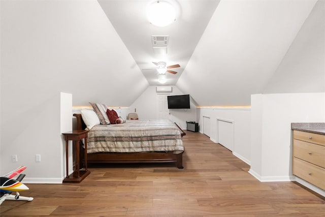 10005 Cormorant Cv, Austin, TX 78730 - bedroom featuring light wood finished floors, vaulted ceiling, and baseboards