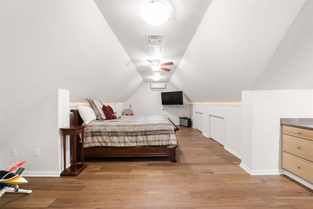 10005 Cormorant Cv, Austin, TX 78730 - bedroom with light wood-type flooring, vaulted ceiling, and baseboards