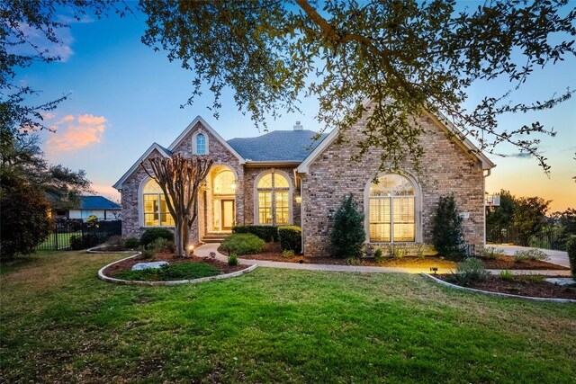 10005 Cormorant Cv, Austin, TX 78730 - traditional-style house featuring brick siding and a chimney