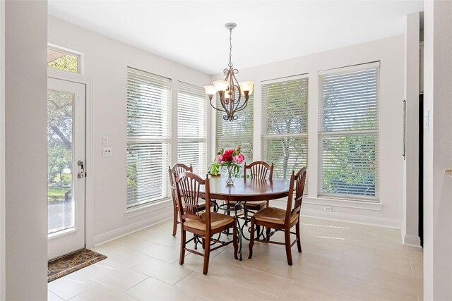 10005 Cormorant Cv, Austin, TX 78730 - dining space with a chandelier, baseboards, and light tile patterned floors