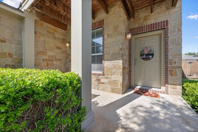 2125 Conner Dr, New Braunfels, TX 78130 - property entrance featuring stone siding