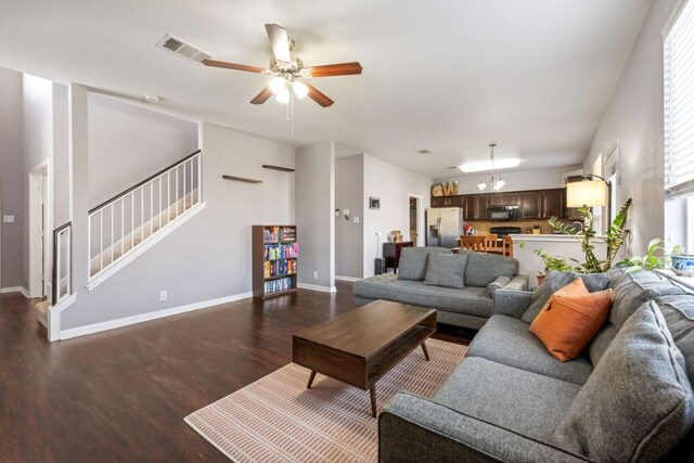 2125 Conner Dr, New Braunfels, TX 78130 - living area with a ceiling fan, dark wood-style floors, stairway, and plenty of natural light