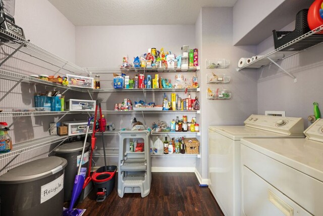 2125 Conner Dr, New Braunfels, TX 78130 - laundry room with washer and dryer, wood finished floors, and baseboards