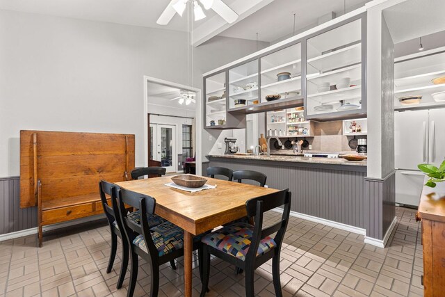 3806 Eagle Way, Round Rock, TX 78681 - dining space featuring ceiling fan, brick patterned floors, and a wainscoted wall
