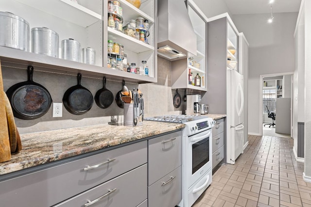 3806 Eagle Way, Round Rock, TX 78681 - kitchen featuring white appliances, gray cabinets, open shelves, and extractor fan