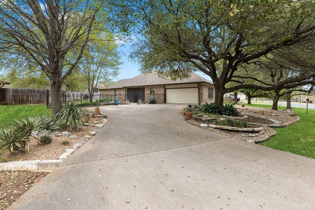 3806 Eagle Way, Round Rock, TX 78681 - single story home with an attached garage, brick siding, and driveway