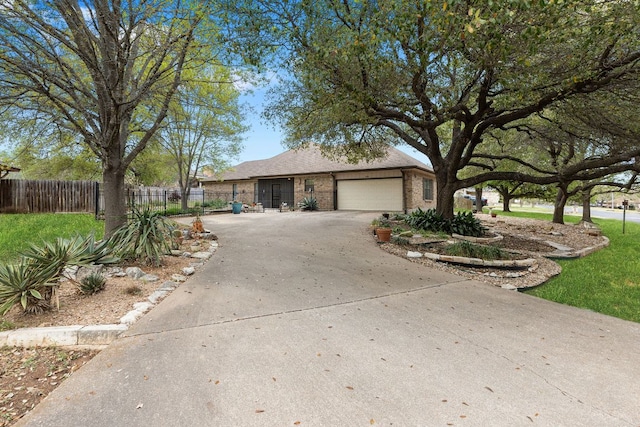 3806 Eagle Way, Round Rock, TX 78681 - ranch-style home with a garage, brick siding, and driveway