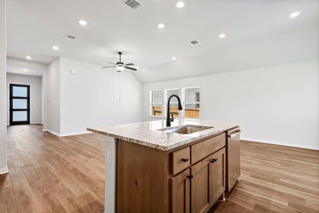 341 Fawn River Run, Kyle, TX 78640 - kitchen with a sink, plenty of natural light, a center island with sink, baseboards, and recessed lighting