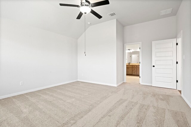 341 Fawn River Run, Kyle, TX 78640 - unfurnished bedroom featuring carpet, baseboards, connected bathroom, a ceiling fan, and high vaulted ceiling