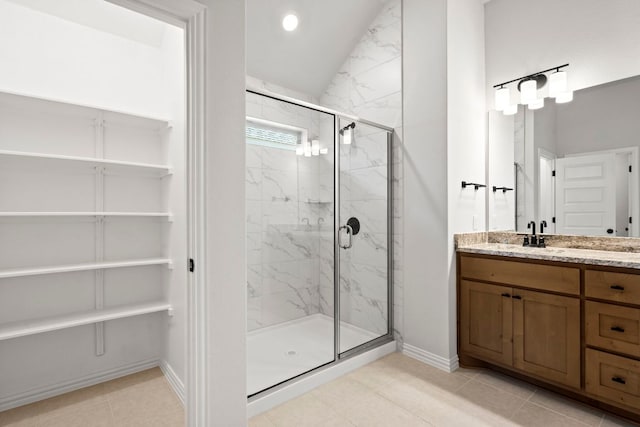 341 Fawn River Run, Kyle, TX 78640 - bathroom featuring a marble finish shower, vanity, baseboards, a closet, and recessed lighting
