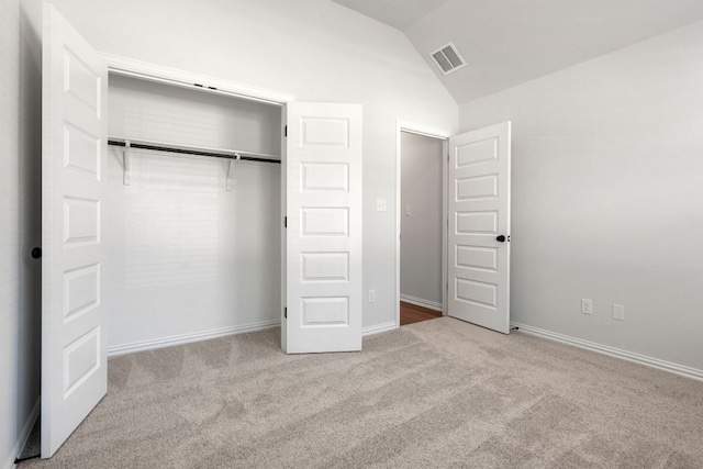 341 Fawn River Run, Kyle, TX 78640 - unfurnished bedroom featuring carpet flooring, lofted ceiling, a closet, and baseboards