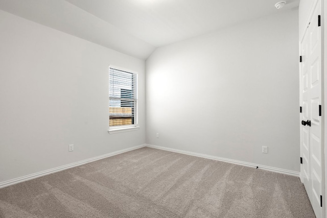 341 Fawn River Run, Kyle, TX 78640 - unfurnished room featuring carpet flooring, lofted ceiling, baseboards, and a smoke detector