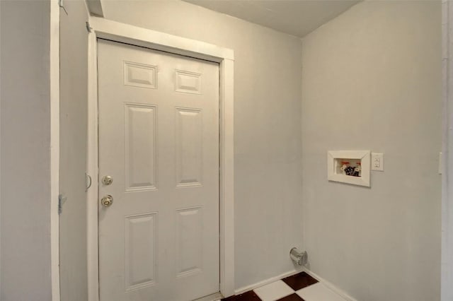 clothes washing area featuring baseboards, laundry area, and hookup for a washing machine