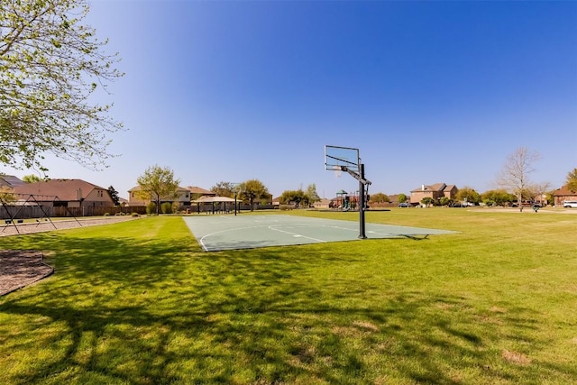 868 Water Hyacinth Loop, Leander, TX 78641 - view of basketball court with community basketball court, a yard, and a residential view