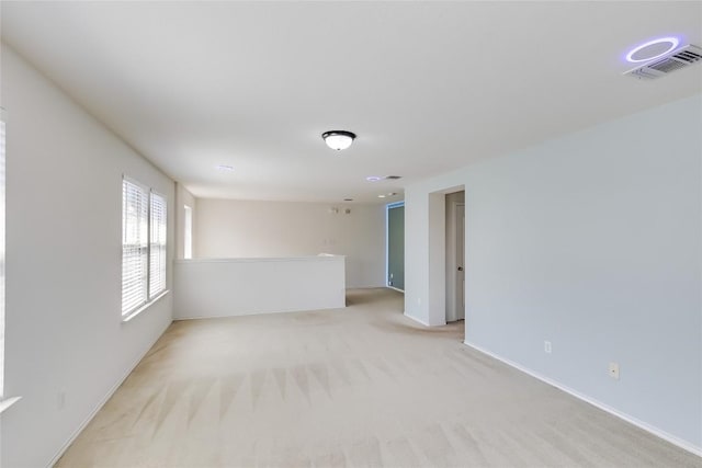 868 Water Hyacinth Loop, Leander, TX 78641 - spare room featuring light colored carpet and baseboards