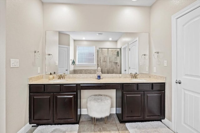 2316 Centennial Loop, Round Rock, TX 78665 - bathroom featuring double vanity, a shower stall, and tile patterned flooring