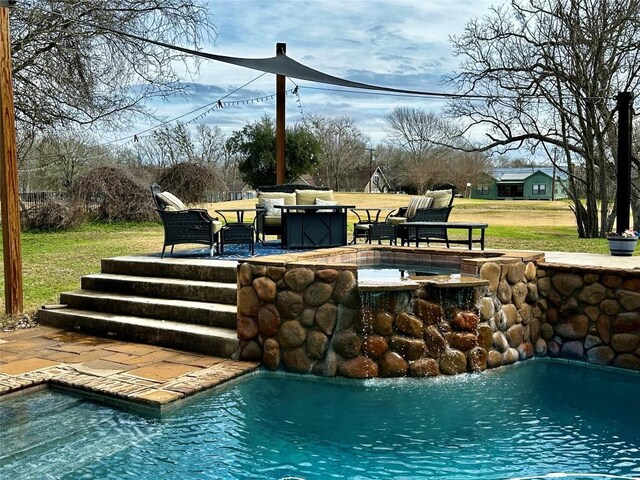 159 Moku Manu Dr, Bastrop, TX 78602 - outdoor pool featuring an in-ground hot tub, a patio area, and a lawn