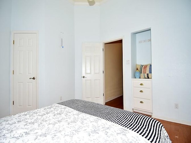 159 Moku Manu Dr, Bastrop, TX 78602 - bedroom featuring wood finished floors and a high ceiling