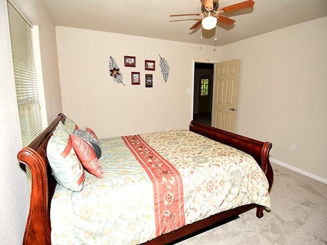 159 Moku Manu Dr, Bastrop, TX 78602 - carpeted bedroom with multiple windows and a ceiling fan