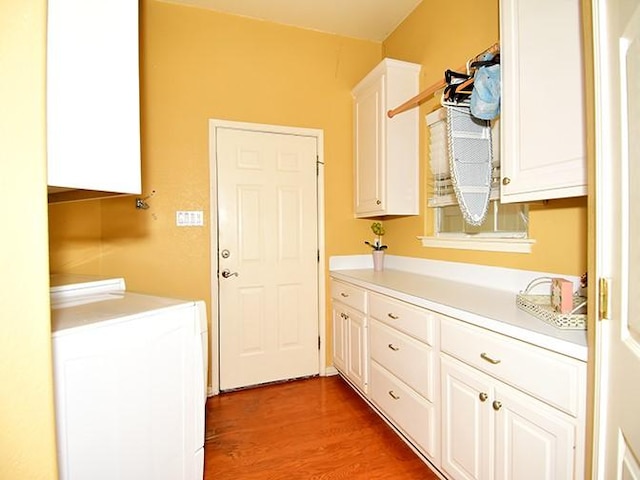 159 Moku Manu Dr, Bastrop, TX 78602 - laundry area featuring cabinet space and light wood finished floors