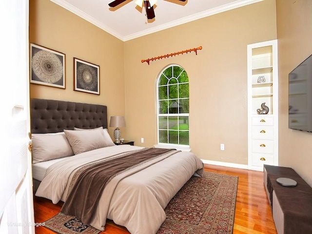 159 Moku Manu Dr, Bastrop, TX 78602 - bedroom featuring wood finished floors, crown molding, and ceiling fan