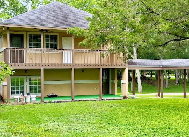 159 Moku Manu Dr, Bastrop, TX 78602 - back of house featuring a shingled roof and a yard