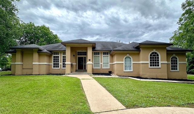 159 Moku Manu Dr, Bastrop, TX 78602 - view of front of property featuring stucco siding and a front yard
