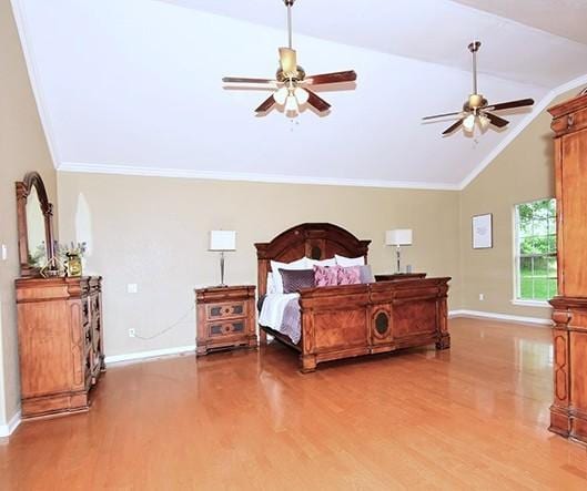 159 Moku Manu Dr, Bastrop, TX 78602 - bedroom featuring wood finished floors, lofted ceiling, a ceiling fan, and crown molding
