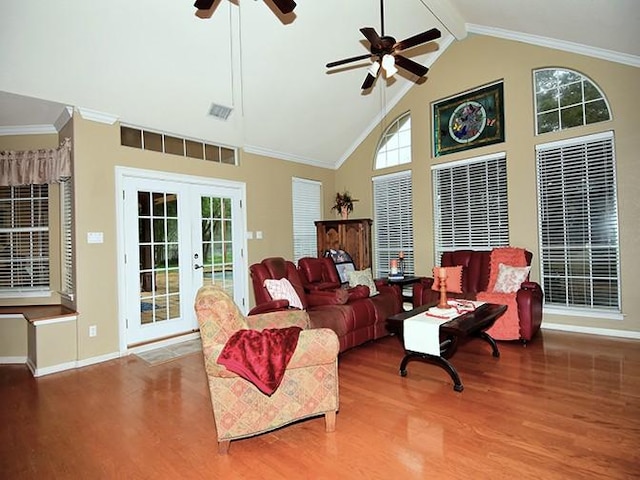 159 Moku Manu Dr, Bastrop, TX 78602 - living area with wood finished floors, a ceiling fan, french doors, beamed ceiling, and high vaulted ceiling