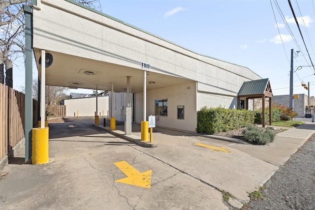 401 Main St, Blanco, TX 78606 - view of parking featuring a carport