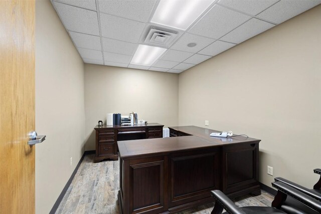 401 Main St, Blanco, TX 78606 - office featuring light wood-style floors, a paneled ceiling, and baseboards