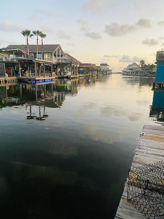 16525 Jamaica Cove Rd, Jamaica Beach, TX 77554 - view of dock featuring a water view