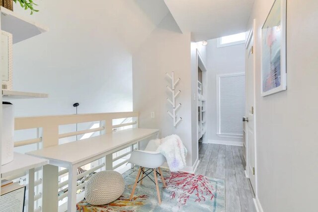 16525 Jamaica Cove Rd, Jamaica Beach, TX 77554 - interior space with baseboards, a high ceiling, and wood finished floors