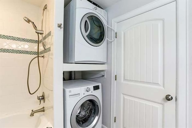 16525 Jamaica Cove Rd, Jamaica Beach, TX 77554 - clothes washing area with stacked washer and clothes dryer and laundry area